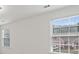 Bedroom with carpet, white trim, and large windows offering natural light and neighborhood views at 3366 Bridge Walk Dr, Lawrenceville, GA 30044