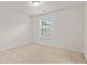 Clean, carpeted bedroom features a sunlit window that offers an airy, comfortable space at 3366 Bridge Walk Dr, Lawrenceville, GA 30044