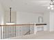 Upstairs bonus room featuring a chandelier and built in office space at 3366 Bridge Walk Dr, Lawrenceville, GA 30044