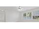 Bonus room with ceiling fan and natural light from the surrounding windows at 3366 Bridge Walk Dr, Lawrenceville, GA 30044
