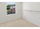 Well-lit walk-in closet with ample shelving and a large window at 3366 Bridge Walk Dr, Lawrenceville, GA 30044