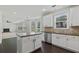 Well-equipped kitchen featuring white cabinets, stainless steel appliances, and a functional center island at 3366 Bridge Walk Dr, Lawrenceville, GA 30044