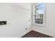 Functional laundry room with storage shelves and a window offering natural light at 3366 Bridge Walk Dr, Lawrenceville, GA 30044
