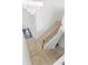 Bright staircase with carpeted steps and iron-spindled railing leads to lower level, and features modern chandelier at 3366 Bridge Walk Dr, Lawrenceville, GA 30044
