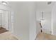 Upper level view of staircase with carpeted steps and chandelier in all-white space at 3366 Bridge Walk Dr, Lawrenceville, GA 30044