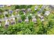 An aerial view of a neighborhood showcasing tree-lined streets and manicured lawns at 4092 Duran Ln, Auburn, GA 30011