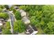 An aerial view of the neighborhood showing tree coverage and landscaping at 4092 Duran Ln, Auburn, GA 30011