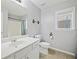 A well-lit bathroom features a single sink vanity and a shower/tub combo at 4092 Duran Ln, Auburn, GA 30011