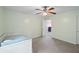 The carpeted bedroom features a ceiling fan, a trundle bed, and an open doorway at 4092 Duran Ln, Auburn, GA 30011