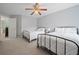 A bright bedroom with neutral walls holds two twin beds with black metal frames at 4092 Duran Ln, Auburn, GA 30011
