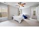 A nicely decorated bedroom with ceiling fan, a twin bed, curtains and bright lighting at 4092 Duran Ln, Auburn, GA 30011