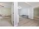 A bonus room featuring an open doorway to a bedroom as well as a sitting area at 4092 Duran Ln, Auburn, GA 30011