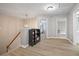 A landing features stairs, a bookshelf and 2 open doors to nearby rooms at 4092 Duran Ln, Auburn, GA 30011