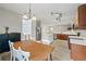 Spacious kitchen and dining area featuring wood cabinets and stainless steel appliances at 4092 Duran Ln, Auburn, GA 30011