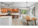 Bright eat-in kitchen with wood cabinets, stainless steel appliances and an island at 4092 Duran Ln, Auburn, GA 30011