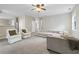 Open-concept living area with ample seating, neutral carpet, and lots of natural light at 4092 Duran Ln, Auburn, GA 30011