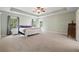 Spacious main bedroom suite with trey ceiling, ceiling fan, and plenty of natural light at 4092 Duran Ln, Auburn, GA 30011