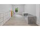 Bright playroom features storage, sofa, and natural light through a large window at 4092 Duran Ln, Auburn, GA 30011