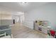 Open playroom with luxury vinyl flooring, toy kitchen, and neutral paint colors at 4092 Duran Ln, Auburn, GA 30011