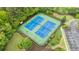 Community tennis courts in an aerial view showing lighting, landscaping and fencing at 4092 Duran Ln, Auburn, GA 30011