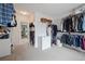 Walk-in closet offers ample storage space, shelving, and plenty of light at 4092 Duran Ln, Auburn, GA 30011