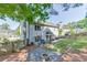 Spacious backyard with a stone fire pit, patio, and lush green lawn at 1755 Waters Ferry Dr, Lawrenceville, GA 30043