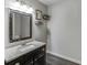 Updated bathroom featuring a granite countertop and decorative accents at 1755 Waters Ferry Dr, Lawrenceville, GA 30043