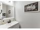 Cozy half bathroom with framed mirror and picture at 1755 Waters Ferry Dr, Lawrenceville, GA 30043