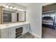 Bathroom features a large mirror, double vanity with white cabinets, and a tiled shower at 1755 Waters Ferry Dr, Lawrenceville, GA 30043