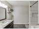 Bathroom boasts granite countertop, dark wood cabinets, and tile flooring at 1755 Waters Ferry Dr, Lawrenceville, GA 30043
