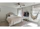 Stylish bedroom features neutral colors, carpet floors, and a cozy hammock at 1755 Waters Ferry Dr, Lawrenceville, GA 30043