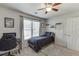 Bedroom with a large window, ceiling fan and a desk and chair at 1755 Waters Ferry Dr, Lawrenceville, GA 30043
