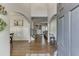 Inviting foyer showcasing hardwood floors, arched doorways, and sightlines into living spaces at 1755 Waters Ferry Dr, Lawrenceville, GA 30043