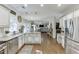 Bright kitchen featuring granite countertops, stainless steel appliances, hardwood floors, and an open floor plan at 1755 Waters Ferry Dr, Lawrenceville, GA 30043