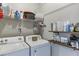 Functional laundry room with storage shelves and washer and dryer at 1755 Waters Ferry Dr, Lawrenceville, GA 30043