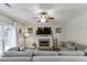 Cozy living room with fireplace, modern decor, large windows, and comfortable seating at 1755 Waters Ferry Dr, Lawrenceville, GA 30043