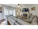 Cozy living room with fireplace, modern decor, large windows, and comfortable seating at 1755 Waters Ferry Dr, Lawrenceville, GA 30043