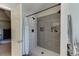 Bathroom features a modern tiled shower with built-in shelving and a rainfall shower head at 1755 Waters Ferry Dr, Lawrenceville, GA 30043