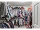 Spacious walk-in closet with ample storage, clothing racks, and shelving for organization at 1755 Waters Ferry Dr, Lawrenceville, GA 30043