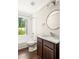 Cozy bathroom with tub/shower combo, and vanity with storage at 2554 Saint Patrick Se St, Atlanta, GA 30317
