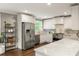 Well-lit kitchen with stainless steel appliances, marble countertops, and white cabinets at 2554 Saint Patrick Se St, Atlanta, GA 30317