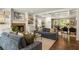 Bright living room with fireplace, custom built-ins and access to dining area at 2554 Saint Patrick Se St, Atlanta, GA 30317