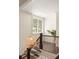 Stairway with wooden railing, natural lighting, and plants at 2554 Saint Patrick Se St, Atlanta, GA 30317