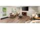 Finished basement living area with walkout, recessed lights, luxury vinyl floors, and cozy seating at 2841 Landing Dr, Marietta, GA 30066