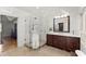 Corner shower with glass enclosure and marble tile, complemented by a dark vanity and luxury fixtures at 2841 Landing Dr, Marietta, GA 30066