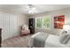Cozy bedroom with plush carpeting, plantation shutters, closet, and a comfortable bed at 2841 Landing Dr, Marietta, GA 30066