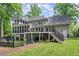 Expansive home exterior featuring a large deck and fenced yard at 2841 Landing Dr, Marietta, GA 30066