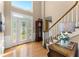 Bright foyer with hardwood floors, decorative front door and sidelights, and elegant staircase at 2841 Landing Dr, Marietta, GA 30066