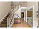 Inviting foyer with hardwood floors, staircase, and view into adjacent room filled with natural light at 2841 Landing Dr, Marietta, GA 30066