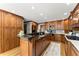 Large kitchen featuring custom cabinets, center island, modern stainless appliances and hardwood floors at 2841 Landing Dr, Marietta, GA 30066